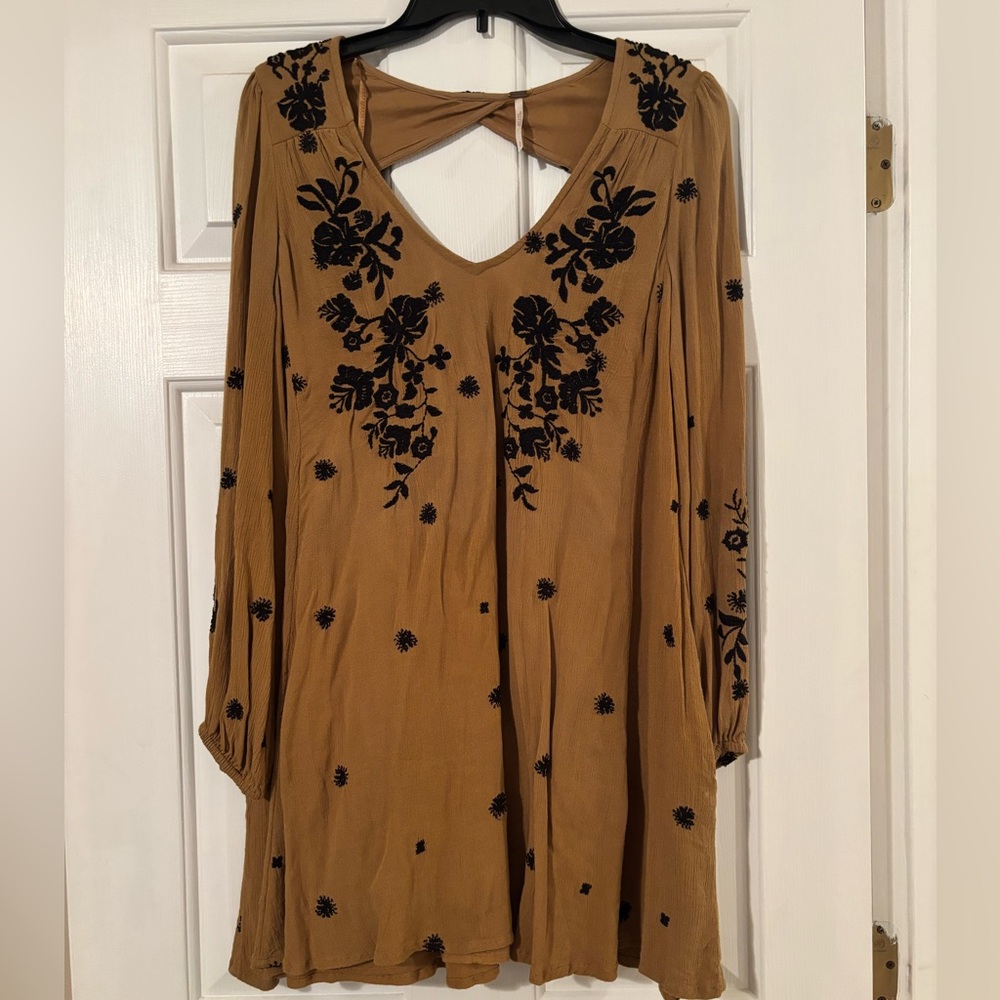 Free People burnt yellow/tan dress with black floral designs. Size S